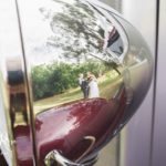 Wedding reflection in chrome headlights
